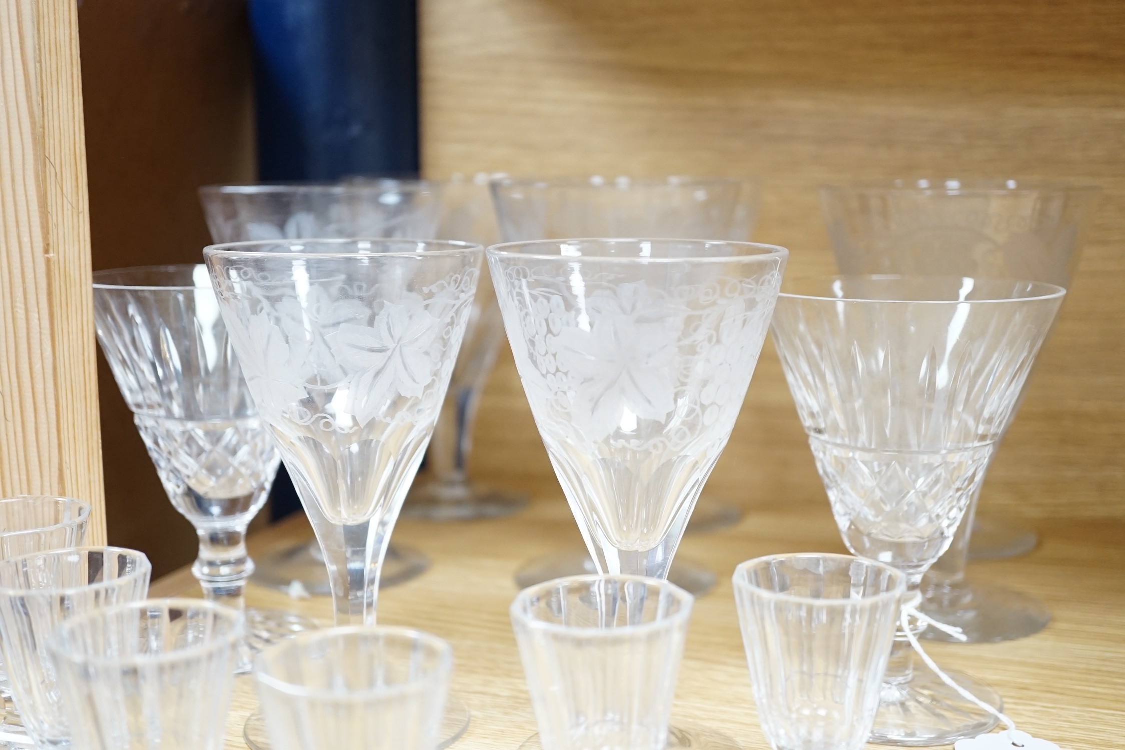 A quantity of engraved and other wine and sherry glasses. Tallest 17cm